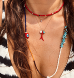 Asia Freshwater Pearl & Coral Necklace worn with layered necklaces in warm sunlight